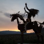 native sculpture at sunset in okanagan valley, british columbia, canada