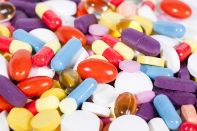 a pile of pills in different colors