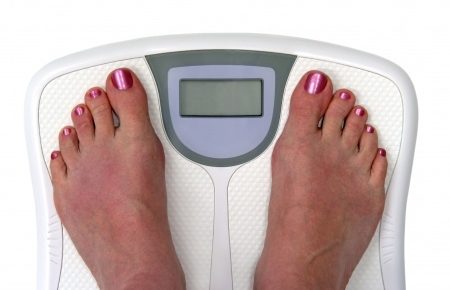 woman's feet on a scale