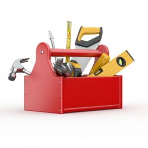 a red toolbox with hammers, screwdrivers, and saws in it