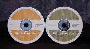 2 CDs; one gold and one green