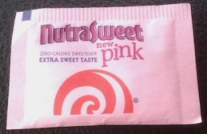a pink packet of NutraSweet Pink