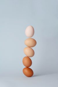 eggs of different colors stacked up