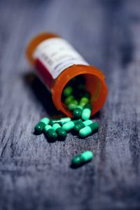 a bottle of medicine spilled pills out