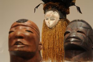 three wooden African masks