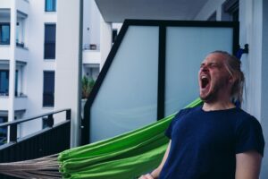 a middle aged man yawning